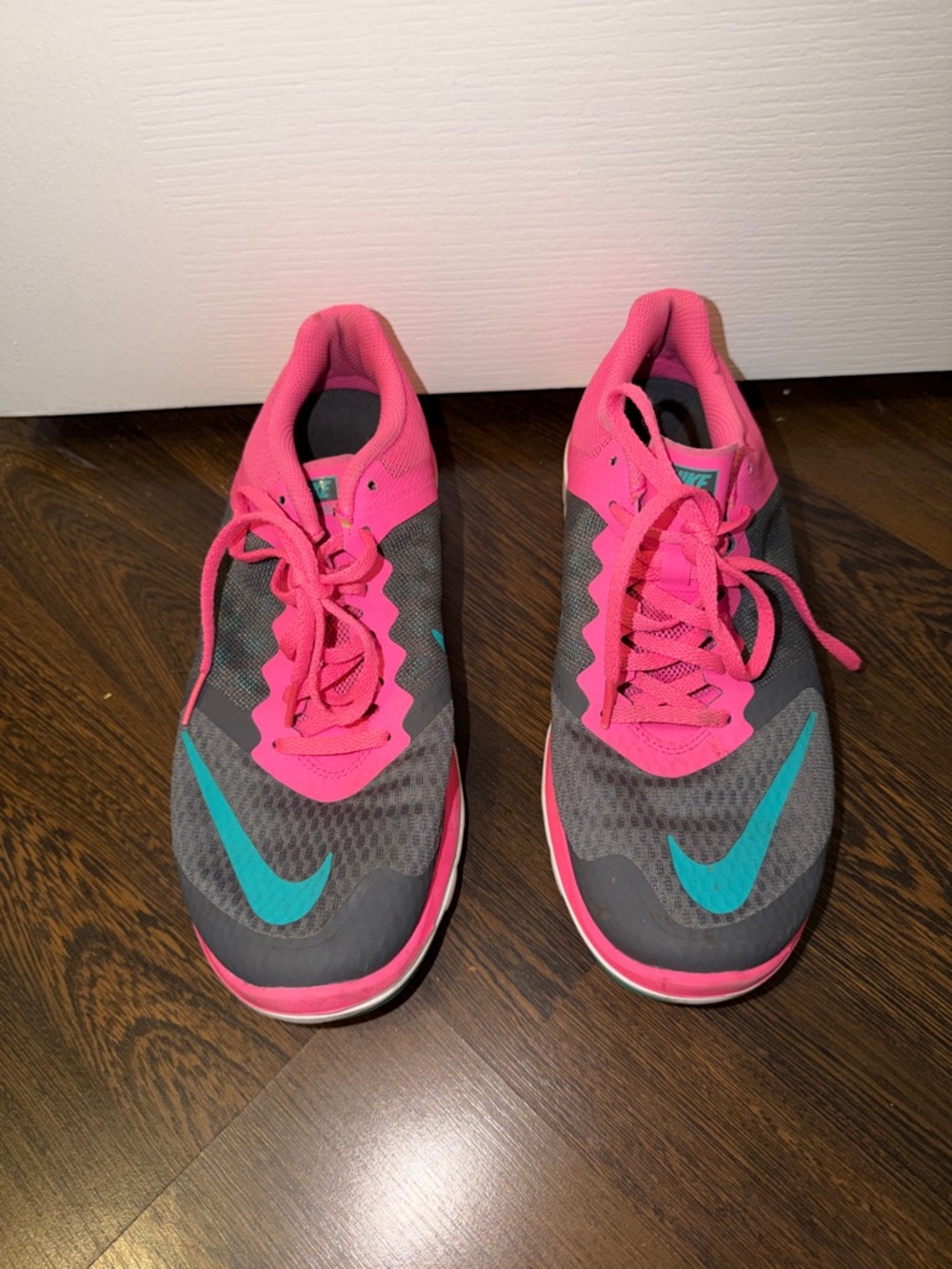Nike Gray Running Sneakers with Pink Accents and Teal Swoosh